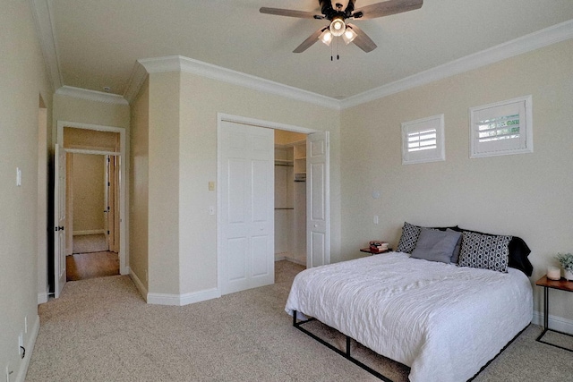 bedroom featuring ceiling fan, baseboards, ornamental molding, and carpet flooring