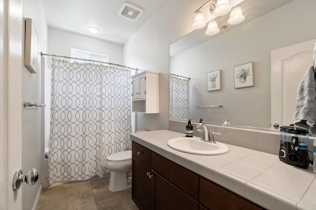 full bathroom with toilet, vanity, and a shower with shower curtain