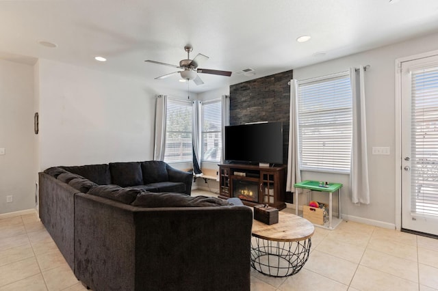living area featuring light tile patterned floors, ceiling fan, baseboards, and recessed lighting