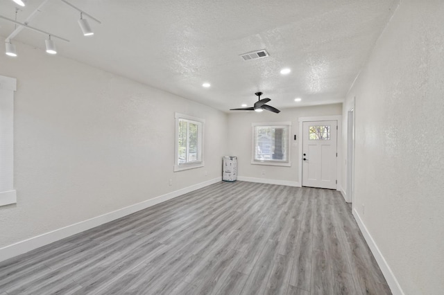 1527 S 3rd St, Fresno, CA 93702 - interior space featuring ceiling fan, wood finished floors, visible vents, and plenty of natural light