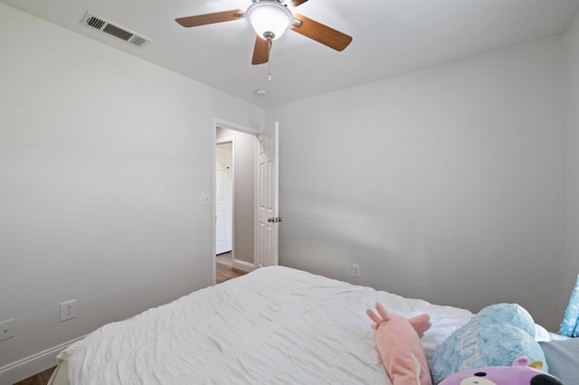 6675 E Montecito Ave, Fresno, CA 93727 - bedroom featuring ceiling fan, baseboards, dark wood-style flooring, and visible vents