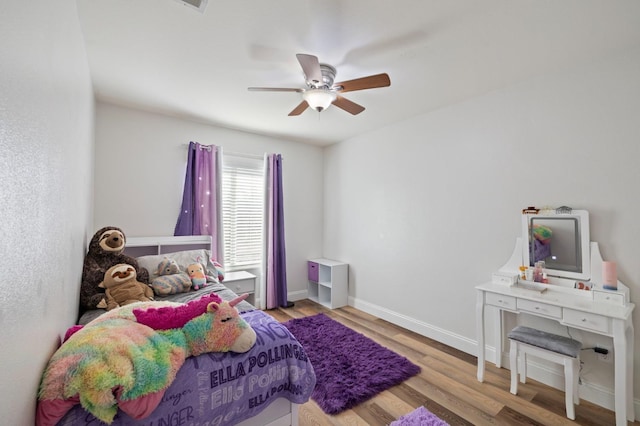 6675 E Montecito Ave, Fresno, CA 93727 - bedroom with wood finished floors, a ceiling fan, and baseboards