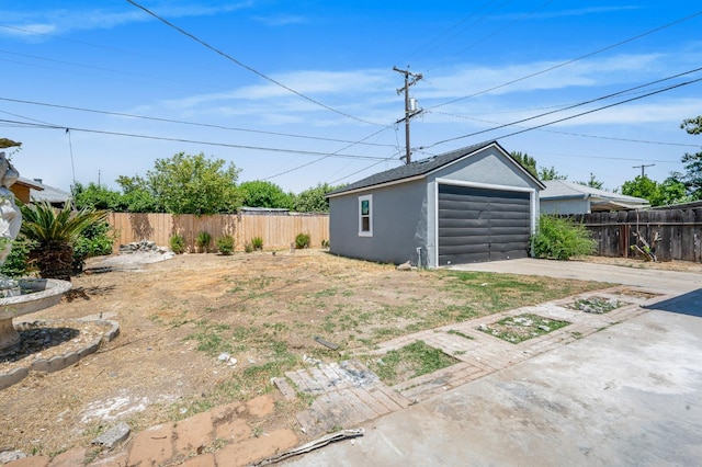 4731 E Laurel Ave, Fresno, CA 93702 - fenced backyard with a garage, an outbuilding, and driveway
