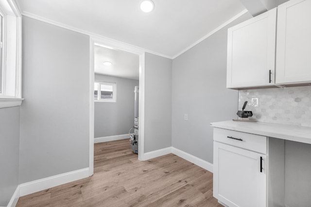 4731 E Laurel Ave, Fresno, CA 93702 - washroom featuring crown molding, light wood finished floors, baseboards, and recessed lighting
