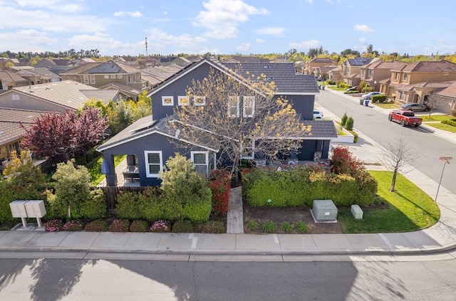 traditional-style house featuring a residential view and stucco siding
