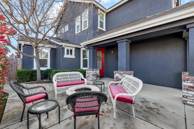 view of patio / terrace featuring an outdoor fire pit