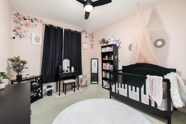 bedroom with a ceiling fan and carpet flooring