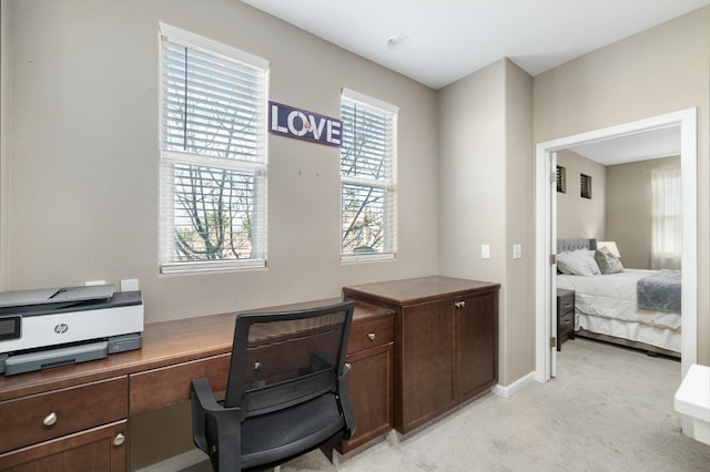 office area with baseboards and light colored carpet