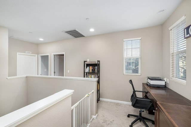 home office featuring baseboards, light carpet, recessed lighting, and visible vents