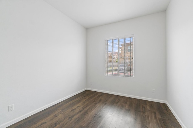 2067 E Axelson Dr, Fresno, CA 93730 - unfurnished room featuring baseboards and dark wood-style flooring