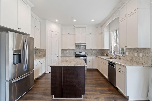 2067 E Axelson Dr, Fresno, CA 93730 - kitchen featuring backsplash, appliances with stainless steel finishes, a sink, and a center island
