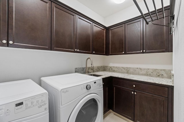 2067 E Axelson Dr, Fresno, CA 93730 - laundry room featuring a sink, washing machine and dryer, and cabinet space