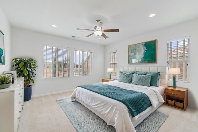 2067 E Axelson Dr, Fresno, CA 93730 - bedroom featuring multiple windows, light colored carpet, recessed lighting, and visible vents