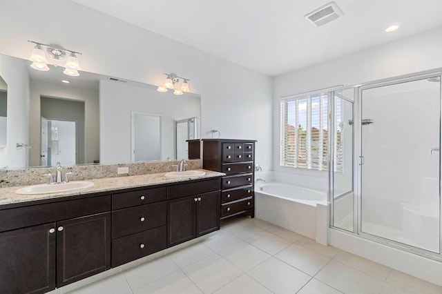 2067 E Axelson Dr, Fresno, CA 93730 - full bath featuring visible vents, a sink, a garden tub, and a stall shower