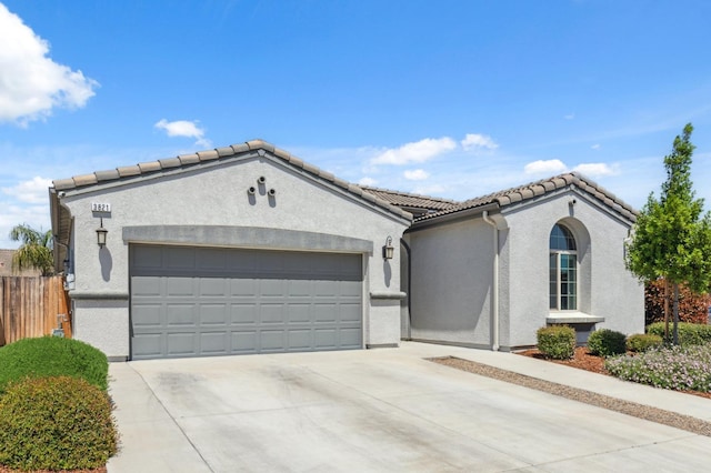 3821 Leigh Ln, Clovis, CA 93619 - ranch-style house with a garage, stucco siding, driveway, and a tile roof