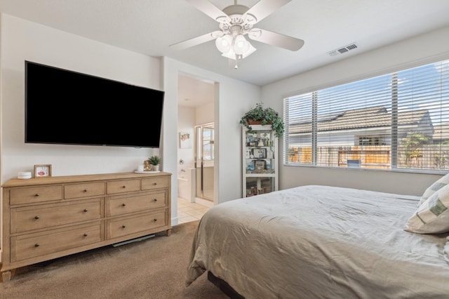 3821 Leigh Ln, Clovis, CA 93619 - bedroom with ensuite bath, visible vents, a ceiling fan, and light carpet