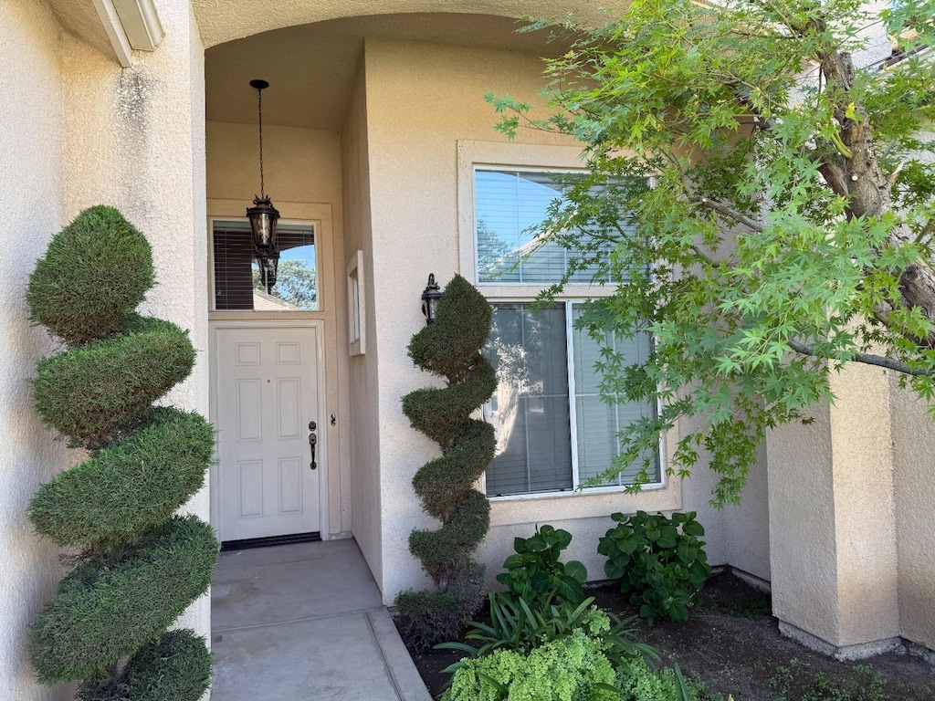 8649 N Backer Ave, Fresno, CA 93720 - property entrance with stucco siding