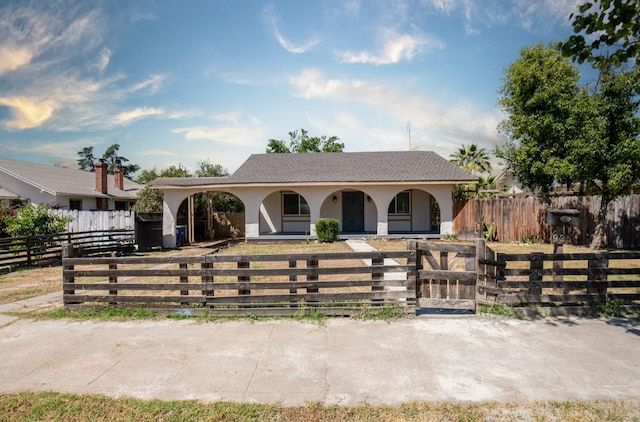 935 E Fedora Ave, Fresno, CA 93704 - ranch-style house with a porch, stucco siding, a fenced front yard, and a gate