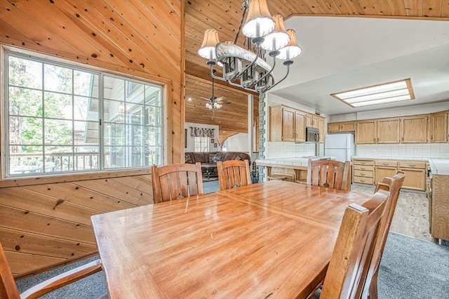 42153 Hemlock Ln, Shaver Lake, CA 93664 - dining space featuring a chandelier and wood walls