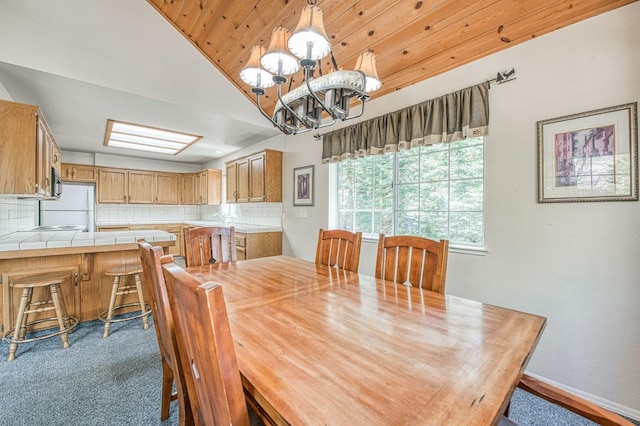 42153 Hemlock Ln, Shaver Lake, CA 93664 - dining area featuring a chandelier, lofted ceiling, and wood ceiling