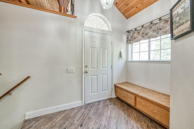 42153 Hemlock Ln, Shaver Lake, CA 93664 - mudroom featuring wood finished floors, vaulted ceiling, and baseboards