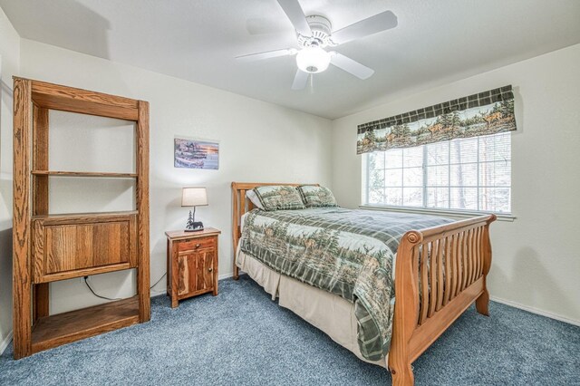42153 Hemlock Ln, Shaver Lake, CA 93664 - carpeted bedroom with baseboards and ceiling fan