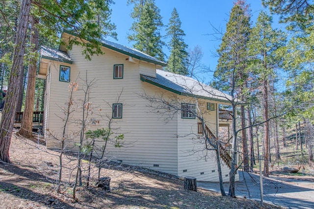42153 Hemlock Ln, Shaver Lake, CA 93664 - view of side of property with crawl space and metal roof