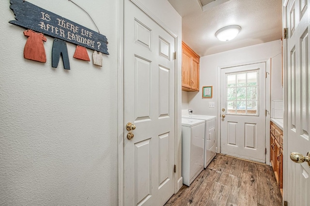 42153 Hemlock Ln, Shaver Lake, CA 93664 - laundry room featuring light wood-style flooring, washing machine and dryer, and cabinet space