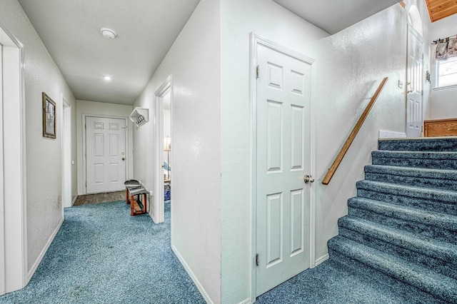 42153 Hemlock Ln, Shaver Lake, CA 93664 - hall featuring carpet flooring, stairs, a textured wall, and baseboards