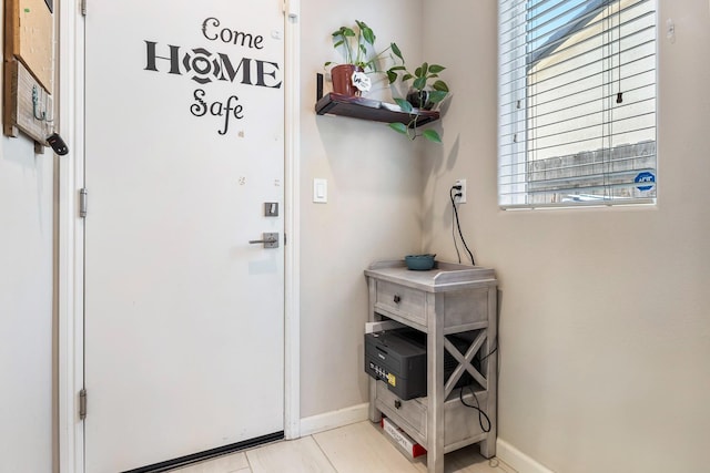 entryway with a healthy amount of sunlight and baseboards