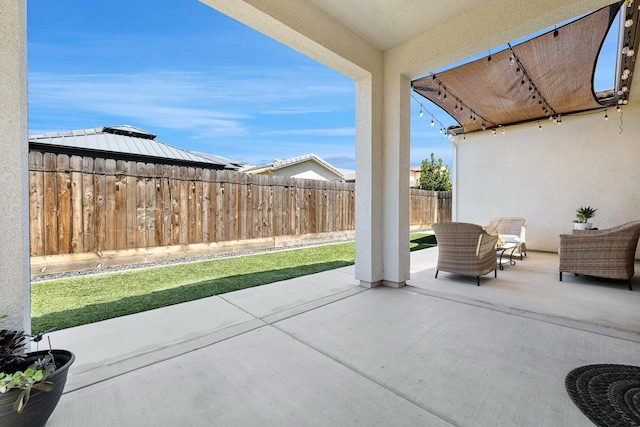 view of patio with a fenced backyard and a gazebo