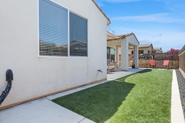 view of yard featuring a fenced backyard and a patio