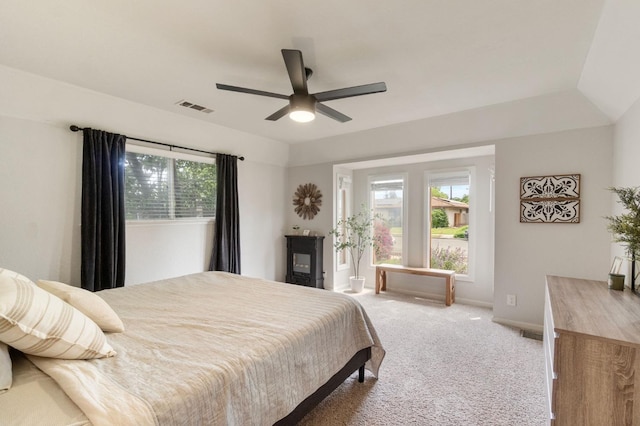 carpeted bedroom with ceiling fan, baseboards, multiple windows, and visible vents