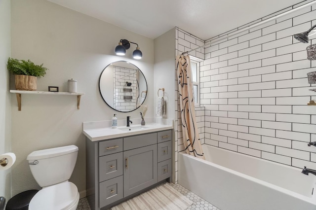 bathroom featuring toilet, vanity, tile patterned floors, and shower / bath combo with shower curtain