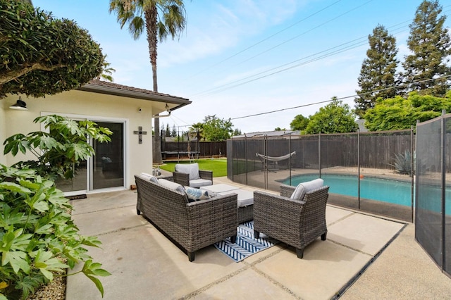340 W Escalon Ave, Fresno, CA 93704 - fenced backyard featuring a trampoline, a patio area, and an outdoor hangout area