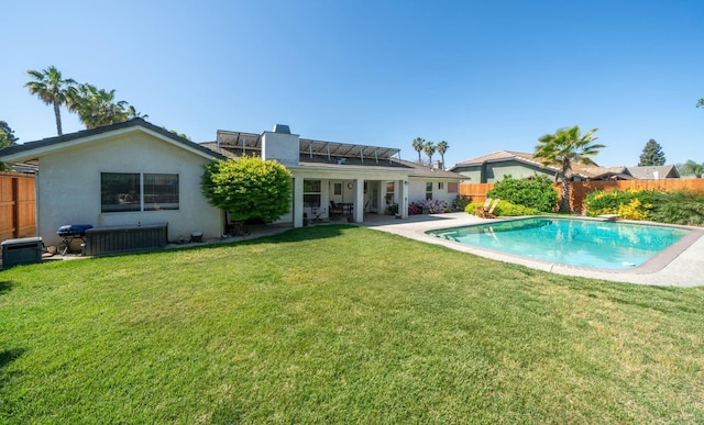 view of pool featuring a fenced backyard, a patio area, a fenced in pool, and a lawn
