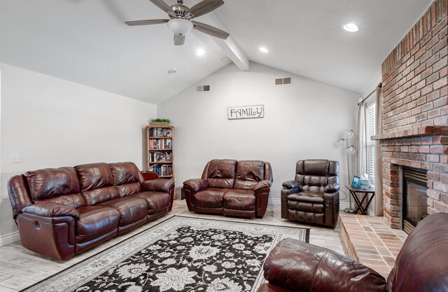 living area featuring a ceiling fan, wood finished floors, lofted ceiling with beams, a fireplace, and visible vents