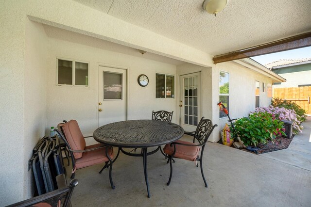 view of patio / terrace featuring outdoor dining area and fence