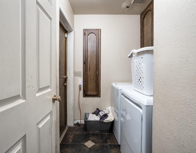 laundry area featuring washing machine and dryer and cabinet space