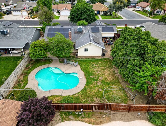 birds eye view of property with a residential view