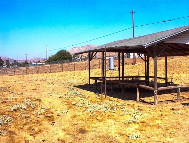 7081 Live Oak, Wonder Valley, CA 93657 - view of yard featuring a mountain view and fence