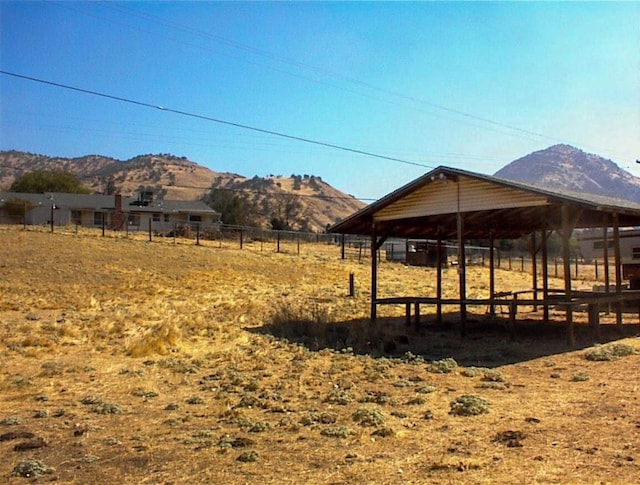 7081 Live Oak, Wonder Valley, CA 93657 - exterior space featuring a mountain view and fence