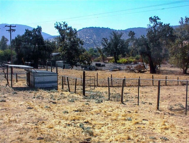 7081 Live Oak, Wonder Valley, CA 93657 - view of yard with fence and a mountain view