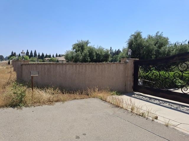 view of gate featuring fence