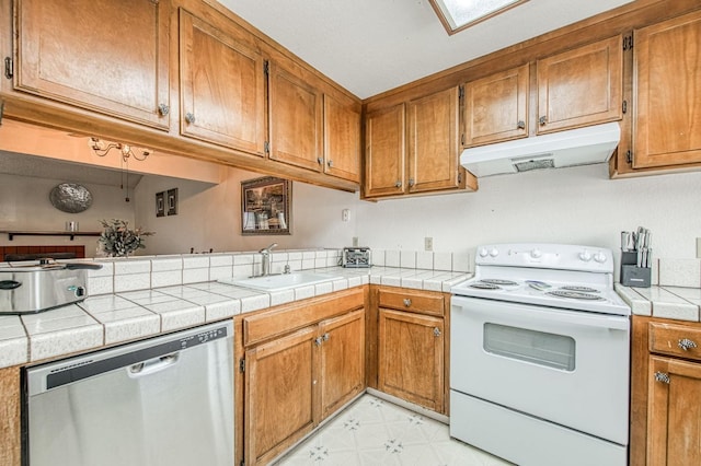 kitchen with white electric range oven, a sink, brown cabinets, dishwasher, and under cabinet range hood