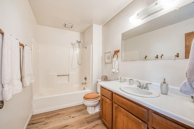 full bathroom featuring toilet, shower / bathtub combination, vanity, and wood finished floors