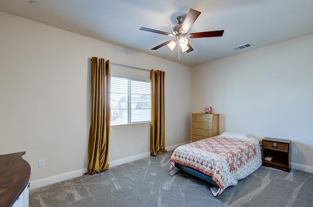 bedroom featuring carpet floors, visible vents, baseboards, and ceiling fan