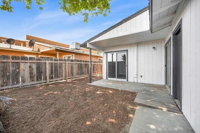 view of yard with a wooden deck and fence