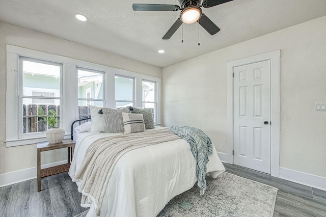2225 N Van Ness Blvd, Fresno, CA 93704 - bedroom with baseboards, wood finished floors, recessed lighting, and ceiling fan