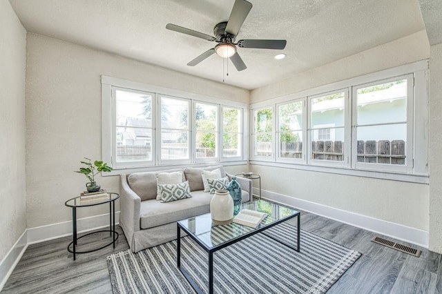 2225 N Van Ness Blvd, Fresno, CA 93704 - sunroom featuring baseboards, a textured ceiling, and wood finished floors